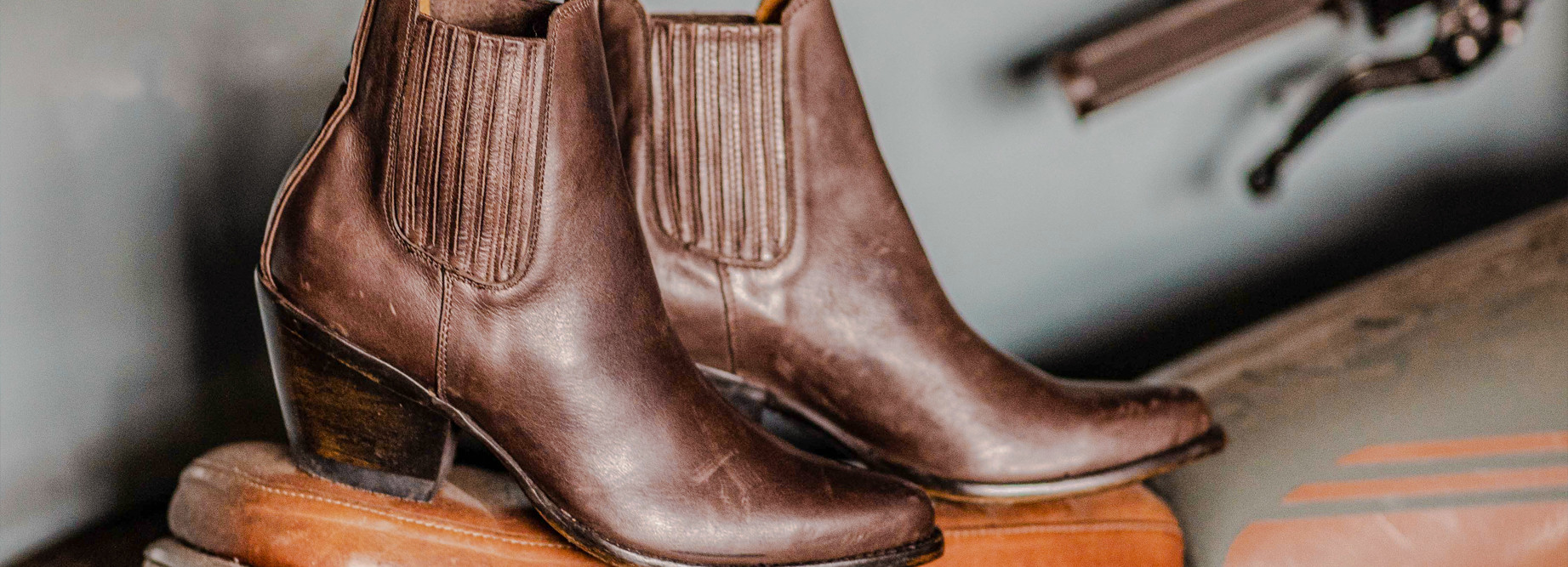 brown western boots in a garage environment